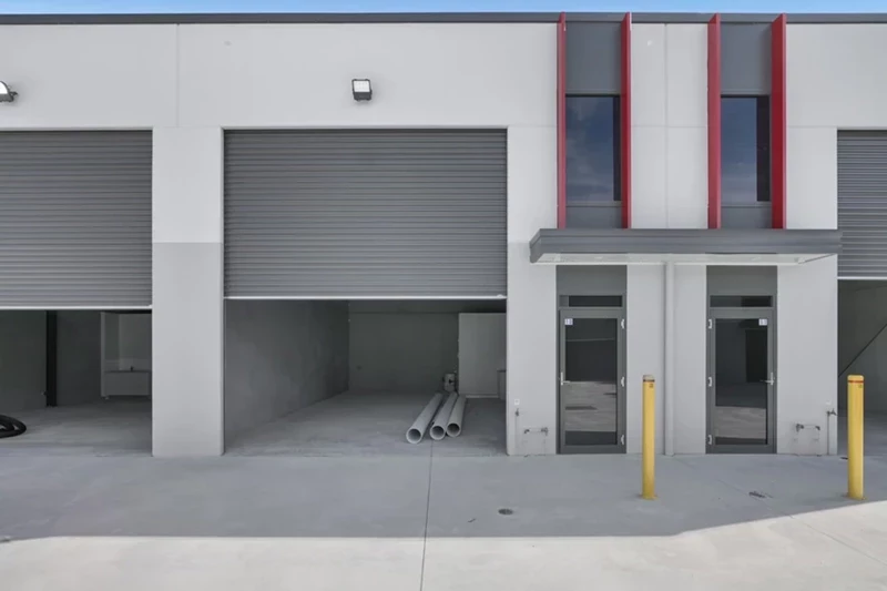 Warehouse with two garage doors and human doors
